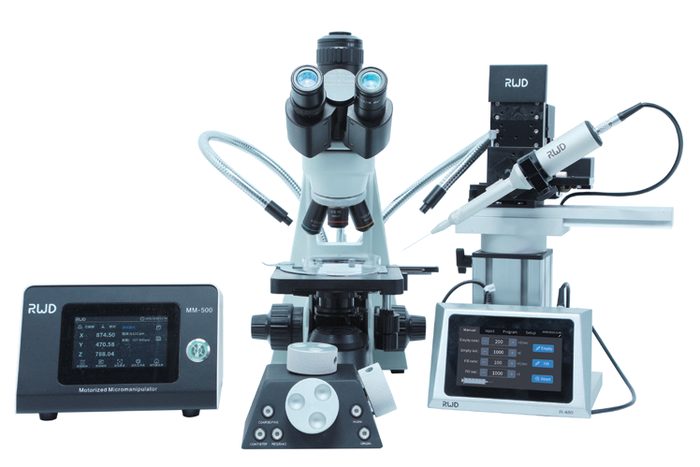 R-480 alongside a microscope for oocyte injection